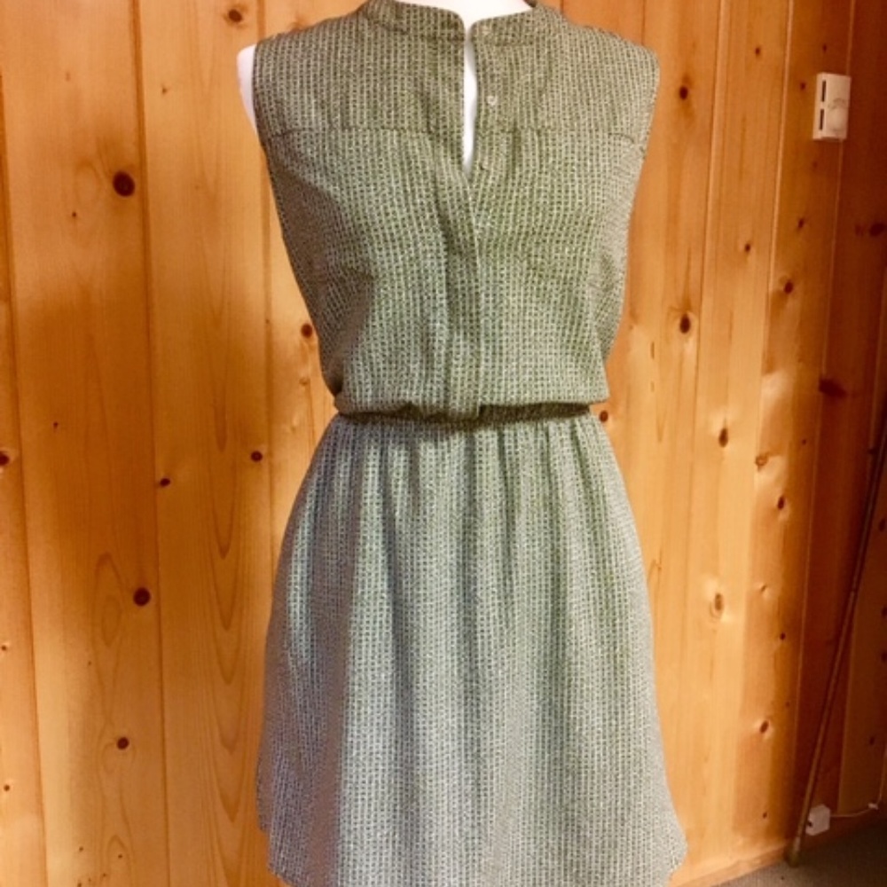 Green and white sleeveless dress